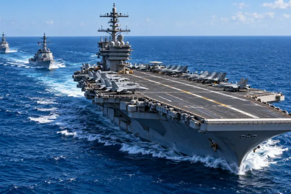 Editorial illustration of a U.S. aircraft carrier with fighter jets on deck and two escort ships underway at sea.